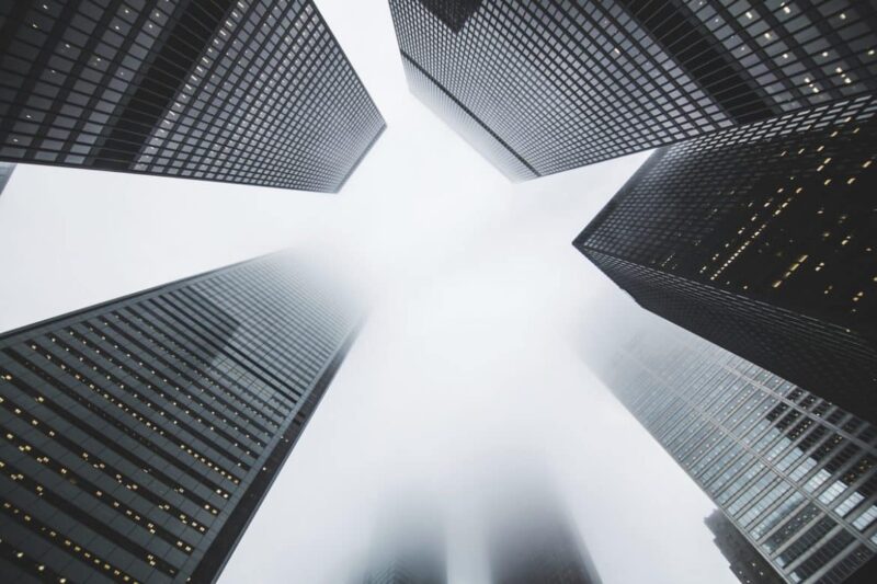 Looking up at city skyscrapers to symbolize the equity to build an ADU
